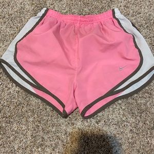 pink nike shorts with white decal dri fit